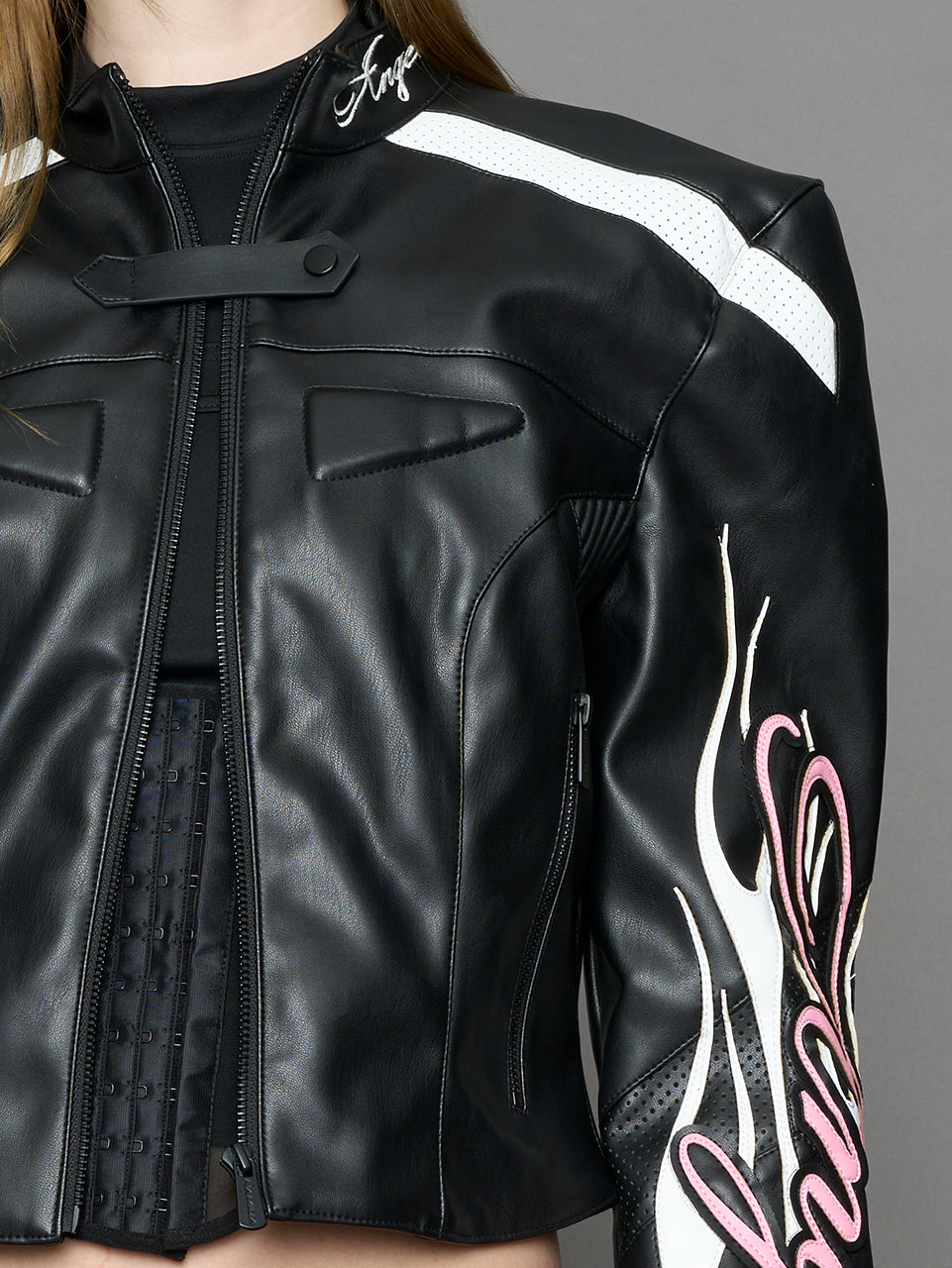 black motocross vegan leather jacket with embroidered sleeve