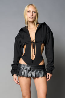 model wears black sweat hoodie body with drawstring closure