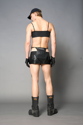 Black vegan leather moto thong mini skirt with lace-up sides, cut-out hips, and zip front – edgy Y2K streetwear skirt for clubwear or festival looks.

