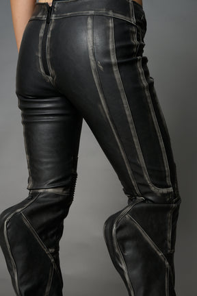 Black washed vegan leather stretch mutant pants with high waist, ribbed knee panels, and exaggerated flared legs by Namilia