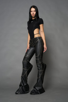Black washed vegan leather stretch mutant pants with high waist, ribbed knee panels, and exaggerated flared legs by Namilia