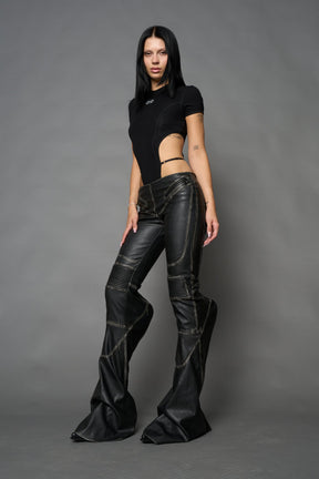 Black washed vegan leather stretch mutant pants with high waist, ribbed knee panels, and exaggerated flared legs by Namilia