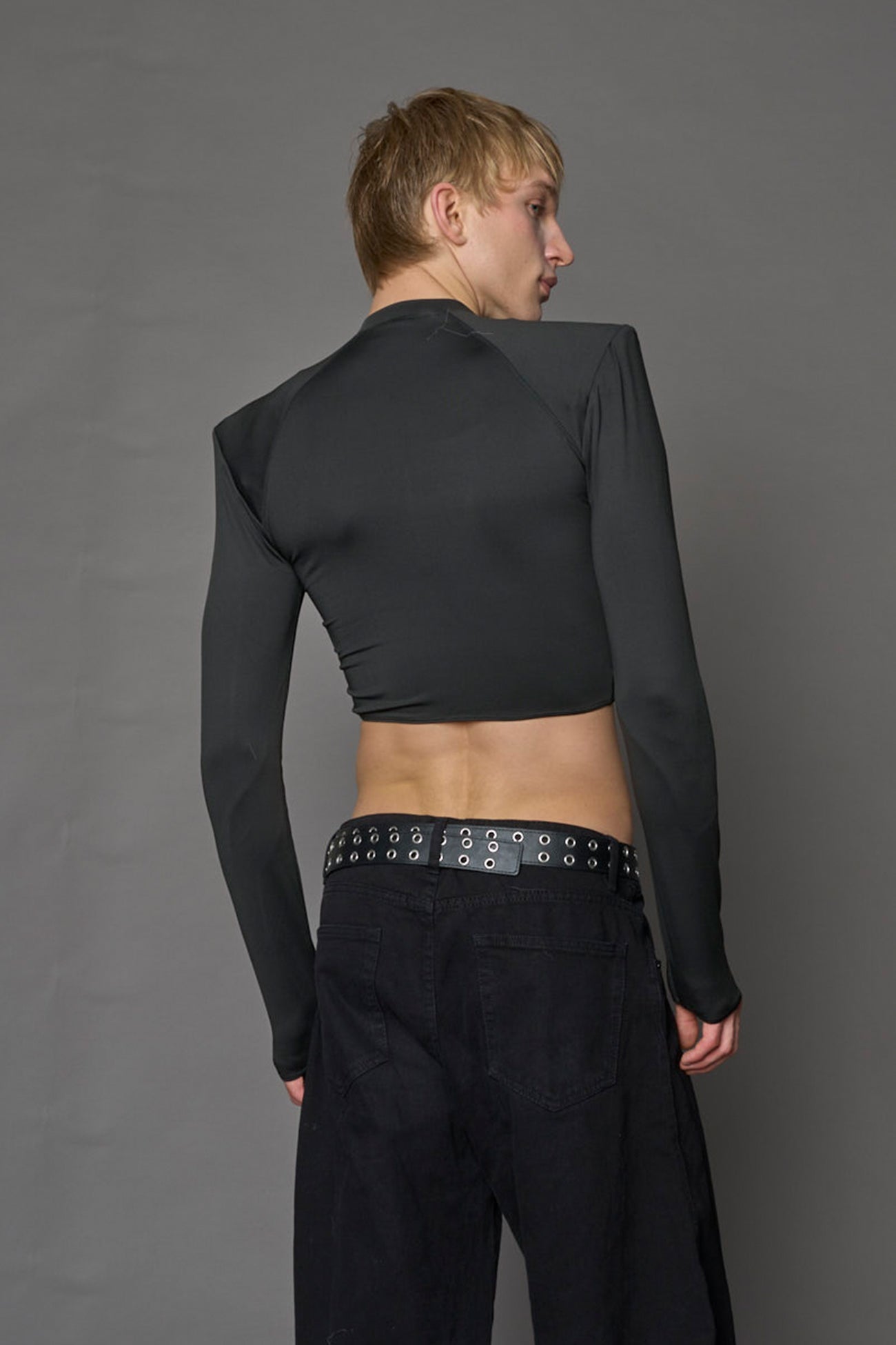 Namilia Pagoda Top in black with sharp padded shoulders and zip front