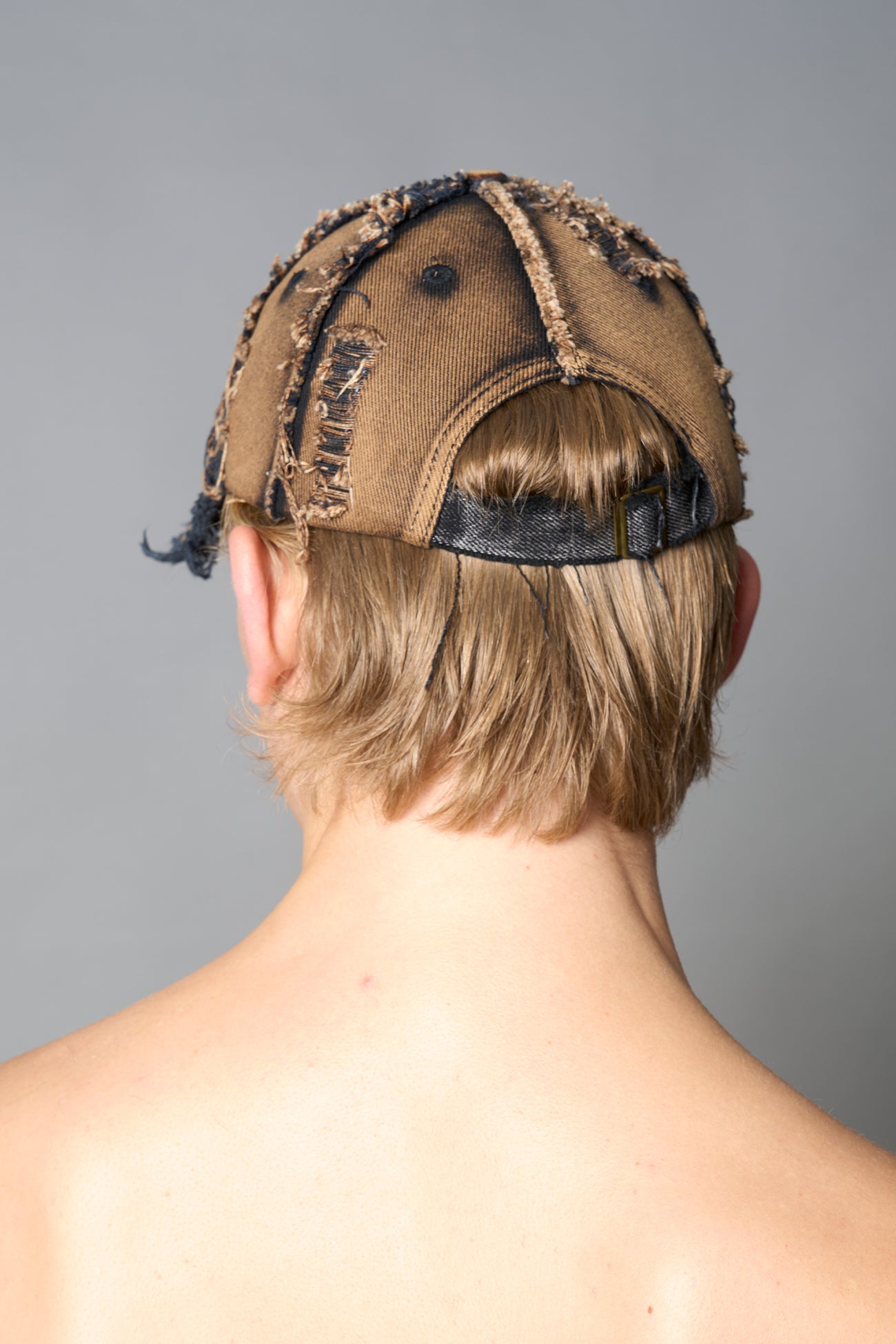 black washed cap with embroidery and snap closure