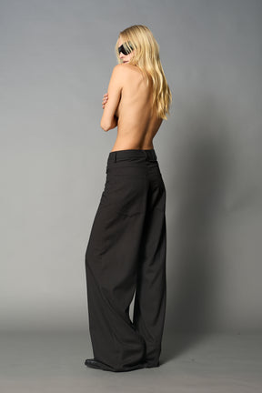 model wearing baggy wool suiting pants black