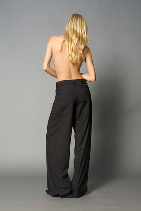 model wearing baggy wool suiting pants black
