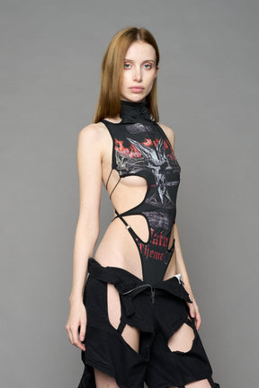 Black print cut-out bodysuit by NAMILIA with high neckline, front zip, adjustable straps, and metal ring detailing