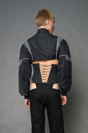 Black Namilia tracksuit jacket with grey sleeve stripes and lace-up corset back