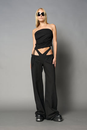 model wearing black soft jersey tbe top with ruching detail on the sides