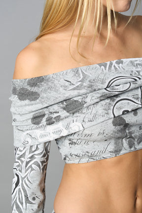 model wearing off shoulder top grey print with foldover detail and long sleeves