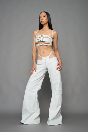 two models wearing white vegan leather pants with thong detail