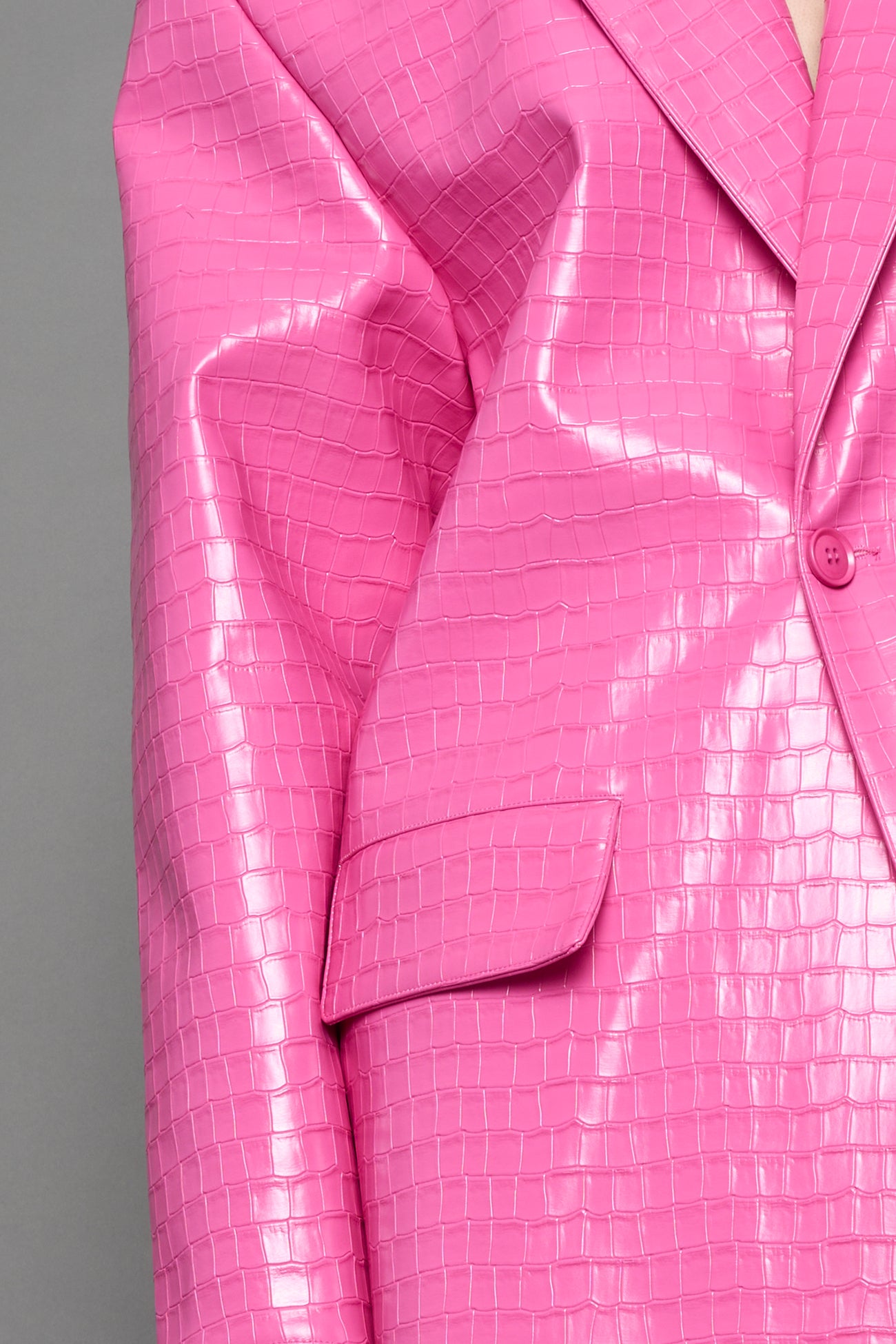 model wearing pink vegan croc leather long blazer coat 