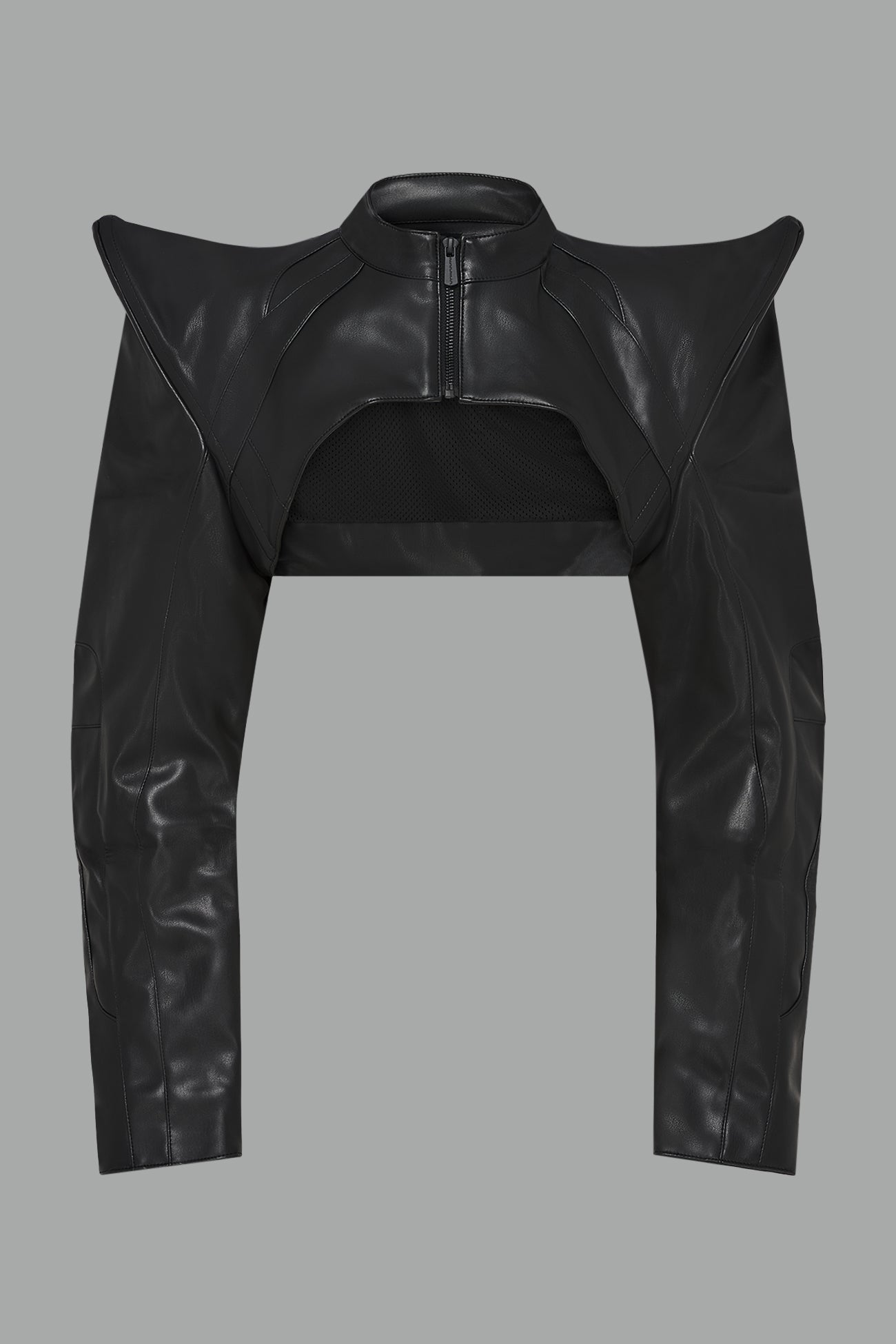 black Namilia Spike Moto Bolero Jacket with wire shoulder pads, cropped hemline, branded front zipper, motocross-style lines, and black rubber logo tag on the back.