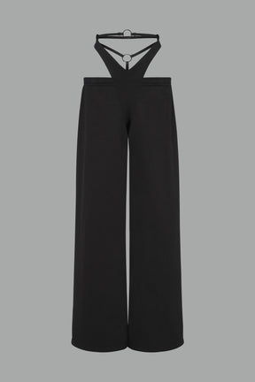 low-rise black wide-leg pants featuring a V-shaped waistband and detachable thong strap detail.