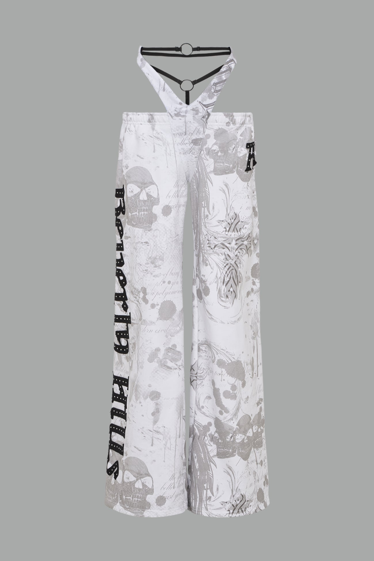 low-rise white wide-leg pants featuring a V-shaped waistband and detachable thong strap detail.