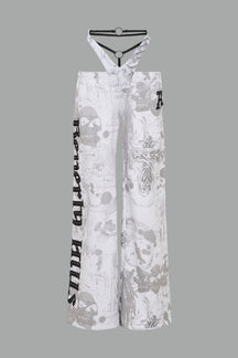 low-rise white wide-leg pants featuring a V-shaped waistband and detachable thong strap detail.